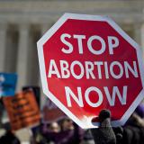 An anti-abortion demonstrator outside the U.S. Supreme Court in Washington, D.C., in March. Last month the high court struck down a Texas law that imposed tight regulations on abortion providers.